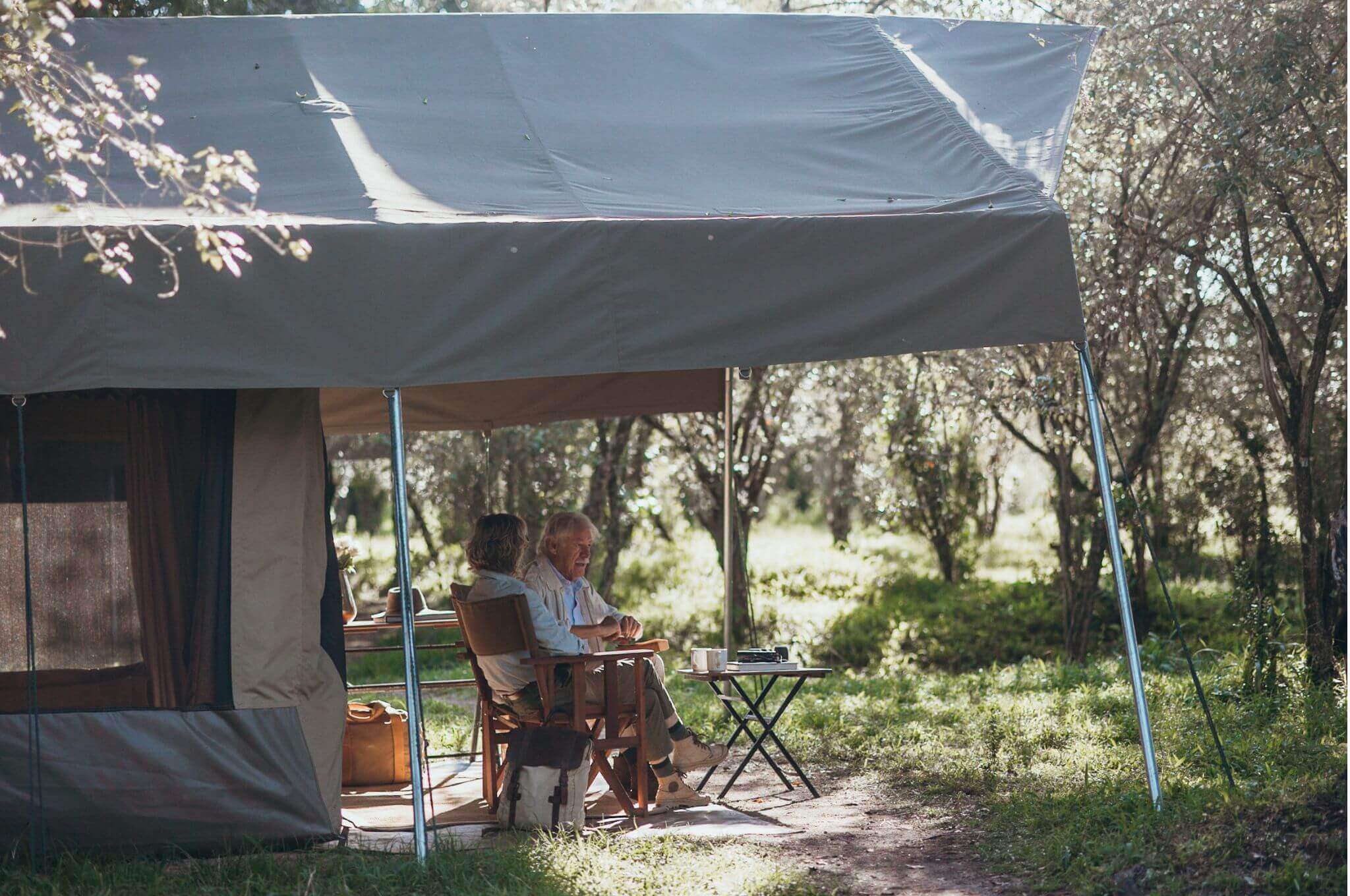 Our custom-made tents offer comfort with spacious beds, en suite bathrooms, and private verandas with stunning views in Kenya’s remote locations